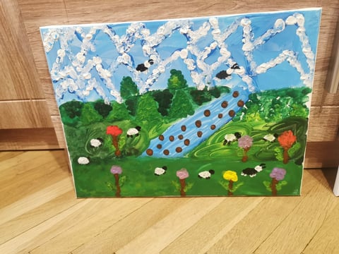 Childs artwork painting of a landscape with blue sky, white clouds, green rolling hills, and colorful flowers with a winding path